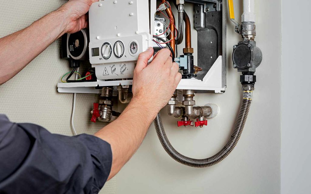 gas heating engineer plumber with boiler