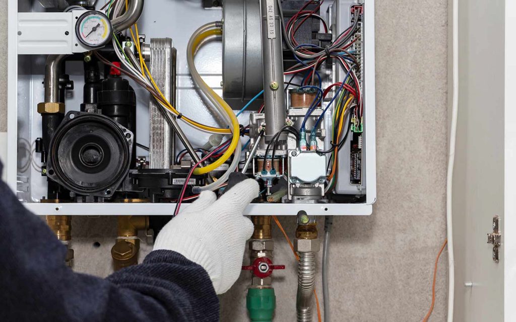gas heating engineer plumber with boiler